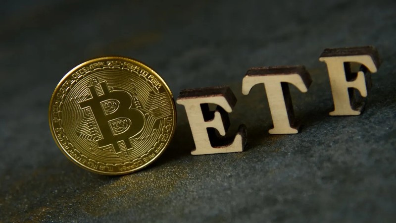 Bitcoin logo and ETF text.